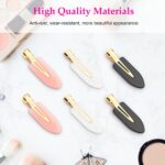 Set of six D creaseless hair clips in black, pink, and white with golden handles, arranged on a surface.