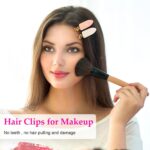 Set of six D creaseless hair clips in black, pink, and white with golden handles, arranged on a surface.