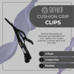 Two black cushion grip hair clips, designed for professional sectioning and styling, shown against a neutral background.