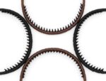 Four multi-colored zig zag headbands for women, shown in a pack, designed for non-slip hair styling.