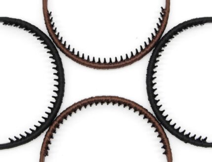 Four multi-colored zig zag headbands for women, shown in a pack, designed for non-slip hair styling.