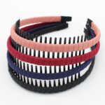 Four multi-colored zig zag headbands for women, shown in a pack, designed for non-slip hair styling.