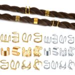 A close-up view of various gold and silver hair braid and dreadlock cuffs, showcasing different unique designs.