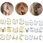 A close-up view of various gold and silver hair braid and dreadlock cuffs, showcasing different unique designs.