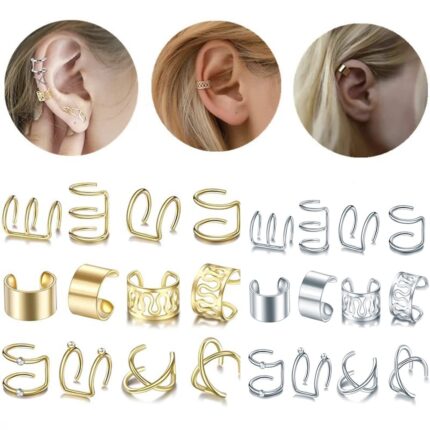 A close-up view of various gold and silver hair braid and dreadlock cuffs, showcasing different unique designs.