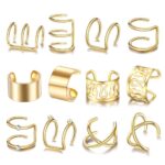 A close-up view of various gold and silver hair braid and dreadlock cuffs, showcasing different unique designs.